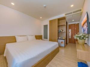 Postel nebo postele na pokoji v ubytování An Bình Tân Hotel
