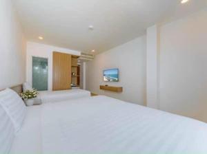 Postel nebo postele na pokoji v ubytování An Bình Tân Hotel