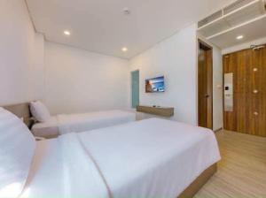 Postel nebo postele na pokoji v ubytování An Bình Tân Hotel