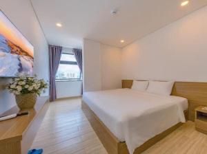 Postel nebo postele na pokoji v ubytování An Bình Tân Hotel