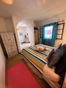 Postel nebo postele na pokoji v ubytování Les Terrasses d'Essaouira - Yoga Studio