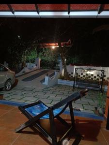 a bench in front of a skate park at night at Nostalgia Homestay in Vythiri