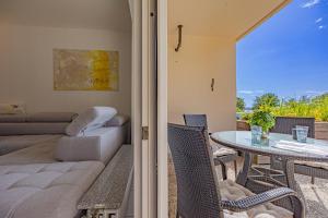 a living room with a couch and a table at fewo1846 - Strandresidenz Wassersleben Meeresbrise App 685 - komfortables Apartment mit Balkon und Meerblick in Harrislee