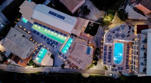 an overhead view of a building with a swimming pool at Palapart Gikas Gouvia in Gouvia