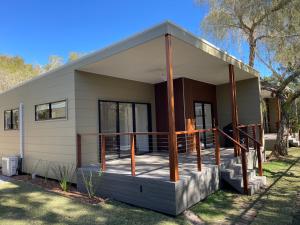 a house with a wrap around porch at BIG4 Tweed Billabong Holiday Park in Tweed Heads