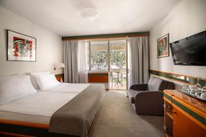 Postel nebo postele na pokoji v ubytování Maistra Select Pineta Hotel