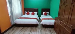 Voodi või voodid majutusasutuse Nepalaya Home Hostel toas