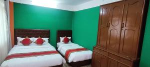 Voodi või voodid majutusasutuse Nepalaya Home Hostel toas