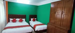 Voodi või voodid majutusasutuse Nepalaya Home Hostel toas