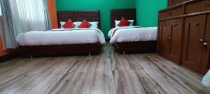 Voodi või voodid majutusasutuse Nepalaya Home Hostel toas