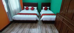 Voodi või voodid majutusasutuse Nepalaya Home Hostel toas