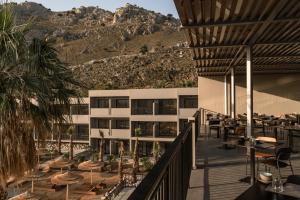 a view of a hotel with a mountain in the background at Cook's Club Kolymbia Rhodes -Adults only in Kolymbia