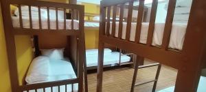 two sets of bunk beds in a room at Nepalaya Home Hostel in Kathmandu
