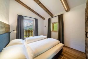 Giường trong phòng chung tại Chalet zu Wosser
