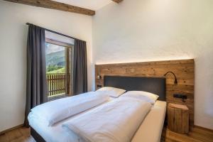 Giường trong phòng chung tại Chalet zu Wosser