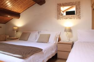 Postel nebo postele na pokoji v ubytování Hotel Aurora