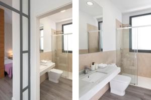 Ein Badezimmer in der Unterkunft Suites Maestranza - Herrería by Magno Apartments