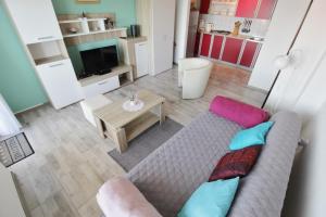 a living room with a couch and a table at Apartment Zeljka in Crveni Vrh