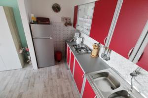 a small kitchen with a sink and a refrigerator at Apartment Zeljka in Crveni Vrh +37 photos