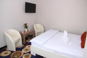Postel nebo postele na pokoji v ubytování Bella Marina