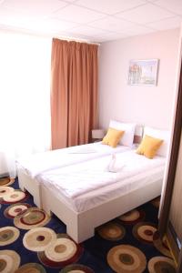 Un pat sau paturi într-o cameră la Bella Marina