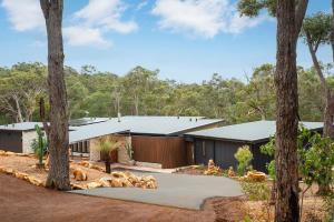 a house in the woods with trees at Raffaele's Estate - Margaret River in Wilyabrup