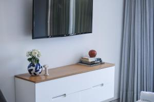 a mirror on top of a dresser in a bedroom at HaTsuk Beach Sea-View Studio by Sea N' Rent in Jlil