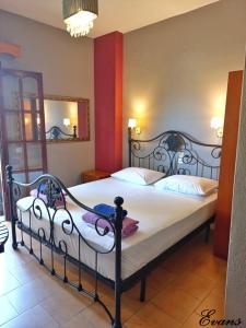 A bed or beds in a room at EVANS Skiathos
