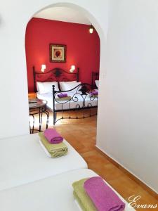 A bed or beds in a room at EVANS Skiathos
