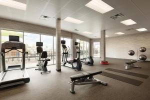a gym with cardio equipment and a large window at Courtyard by Marriott El Paso East/I-10 in El Paso