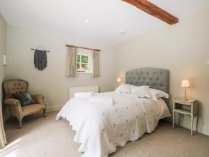 מיטה או מיטות בחדר ב-Hungers Cottage
