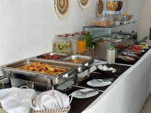 a buffet with many different types of food on it at BLISS Hotel in Ksamil