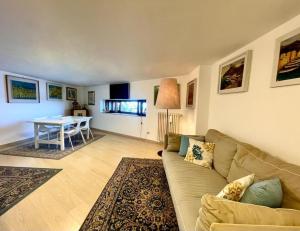 a living room with a couch and a table at Dimora Favale Guglielmi in Polignano a Mare