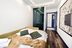 Telewizja i/lub zestaw kina domowego w obiekcie About Art Apartments - Sikorskiego