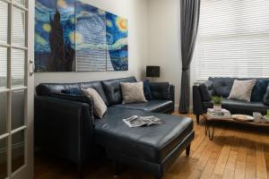 a living room with a couch and a table at Nythfa in Llanrwst