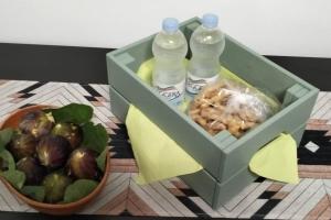 two bottles of water and a basket of fruit at Alloggio privato "Ballatoio233" in Bisceglie +36 photos