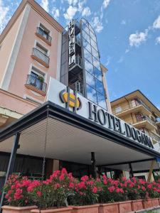 a hotel with a sign on the front of a building at Hotel Dogana in San Marino