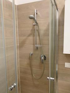 a shower with a shower head in a bathroom at Appartamento Bolzano Centro Talvera in Bolzano +35 photos