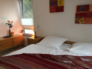 Ένα ή περισσότερα κρεβάτια σε δωμάτιο στο am Heider Bergsee
