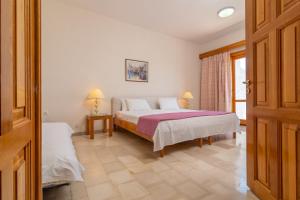Postel nebo postele na pokoji v ubytování Hotel Elman + 18 fotografií