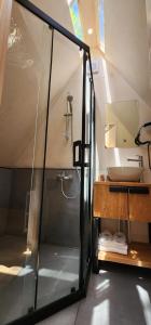 a bathroom with a shower and a sink at LONGOSPHERE GLAMPING in Kırklareli