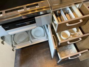 A kitchen or kitchenette at racine(ラシーヌ)【一棟貸切別荘】縄文杉・飲食店へアクセス利便な安房エリア／BBQ利用可能！