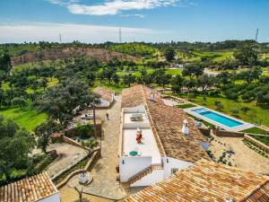 an aerial view of a house with a swimming pool at Casa do Forno (Vale Luis Neto-Retiro do Caldeirão) in Loulé