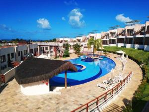 a resort with a swimming pool and a resort at Pipa Brisas do Amor in Pipa