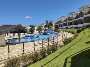 A view of the pool at Pipa Brisas do Amor or nearby
