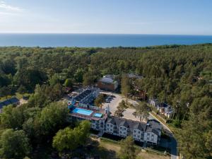 an aerial view of the resort with the ocean in the background at Apartament 8B Blue Marine Poddąbie in Poddąbie