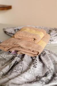 a pair of towels sitting on top of a bed at The Rina Hostel in Agadir