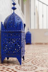 a blue chair sitting on top of a floor at The Rina Hostel in Agadir
