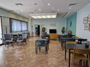 TV a/nebo společenská místnost v ubytování Hotel Dogana