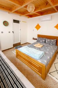 a bedroom with a large bed in a room at The Rina Hostel in Agadir